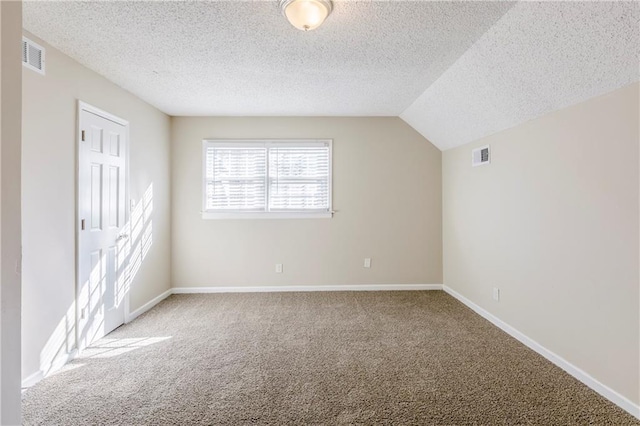 3225 Redona Dr, Atlanta, GA 30349 - additional living space with carpet, a textured ceiling, and lofted ceiling