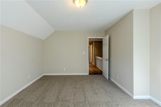 3225 Redona Dr, Atlanta, GA 30349 - bonus room with a textured ceiling, vaulted ceiling, and carpet flooring