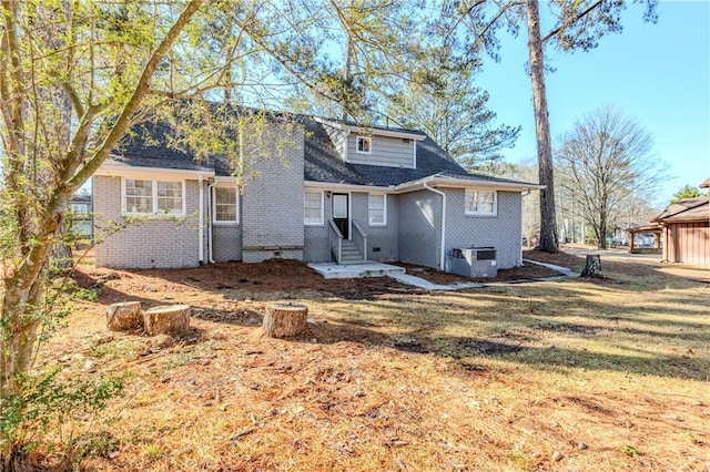 3225 Redona Dr, Atlanta, GA 30349 - rear view of house with central AC unit and a yard