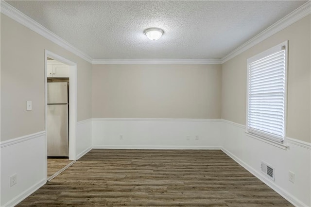 3225 Redona Dr, Atlanta, GA 30349 - empty room with ornamental molding, dark hardwood / wood-style floors, and a textured ceiling
