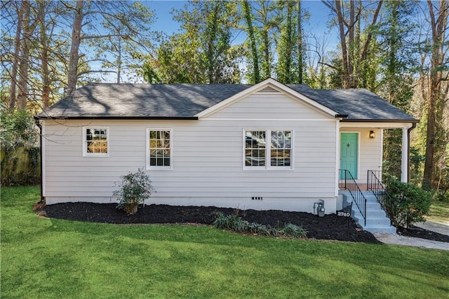 view of front of house with a front yard, crawl space, and roof with shingles