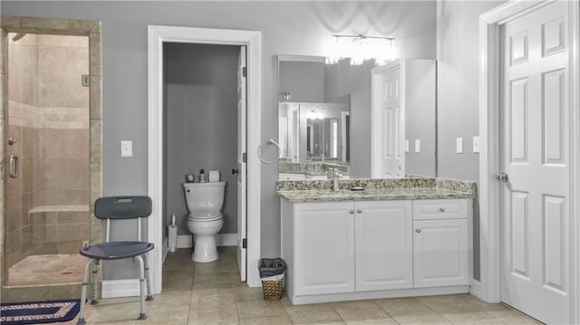 full bathroom with vanity, toilet, baseboards, tile patterned floors, and a shower stall