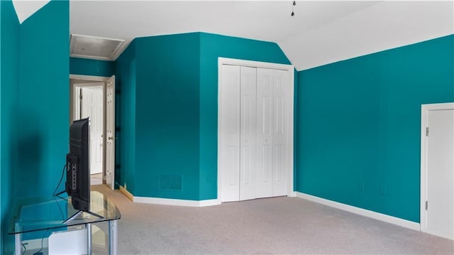 unfurnished bedroom featuring carpet floors, baseboards, a closet, and visible vents