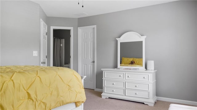carpeted bedroom with baseboards