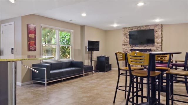 bar with recessed lighting and baseboards