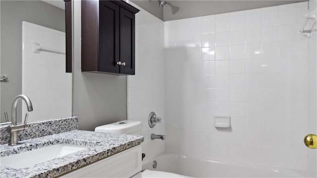 bathroom featuring vanity, shower / bathtub combination, and toilet