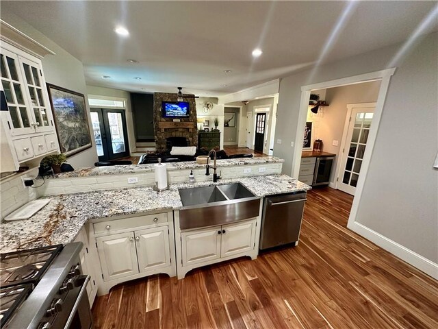 kitchen with sink, appliances with stainless steel finishes, and white cabinets