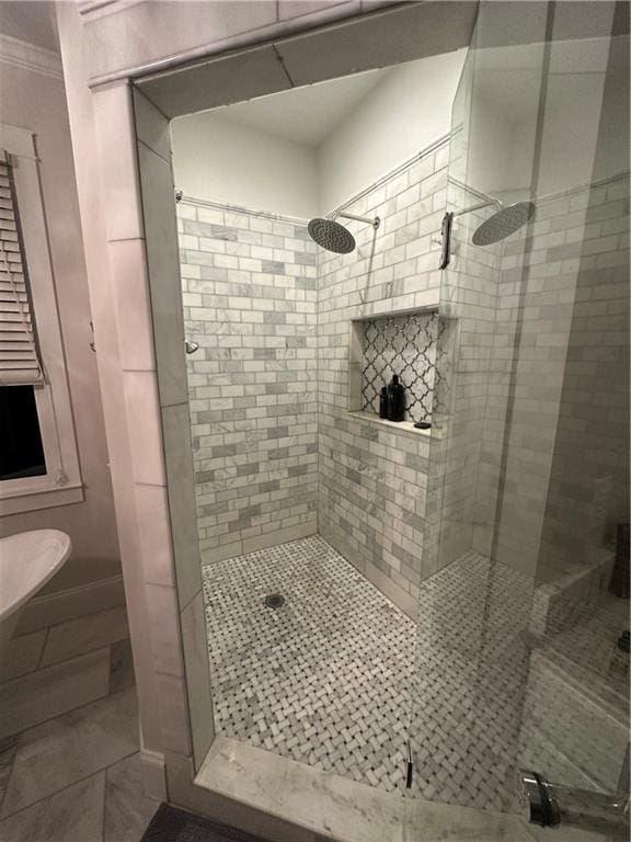 bathroom with toilet, walk in shower, and tile patterned flooring