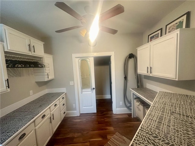 kitchen featuring white cabinets, ceiling fan, and dark hardwood / wood-style flooring