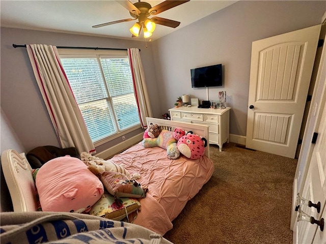 bedroom with dark carpet and ceiling fan