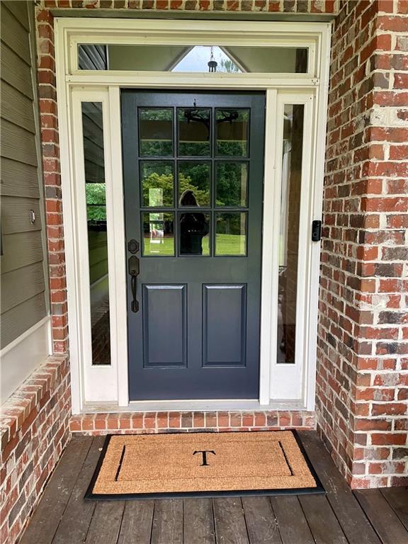 doorway to property with a deck