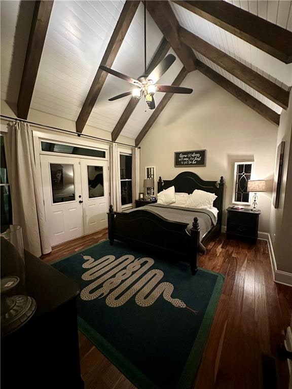 bedroom with dark hardwood / wood-style flooring, lofted ceiling with beams, and ceiling fan