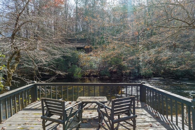 wooden deck featuring a water view