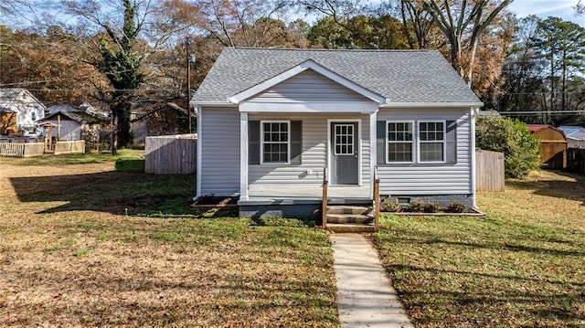 bungalow with a front yard