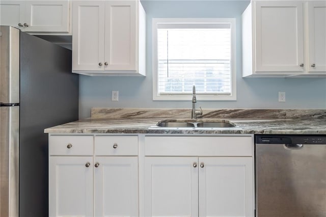 kitchen featuring sink, white cabinetry, and stainless steel appliances