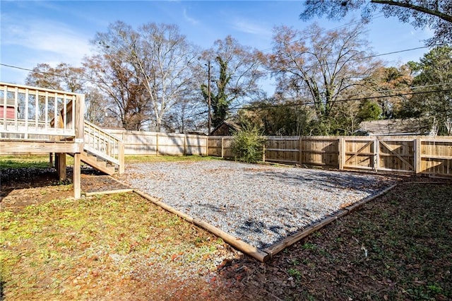 view of yard with a wooden deck