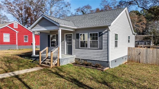 bungalow-style home with a front yard