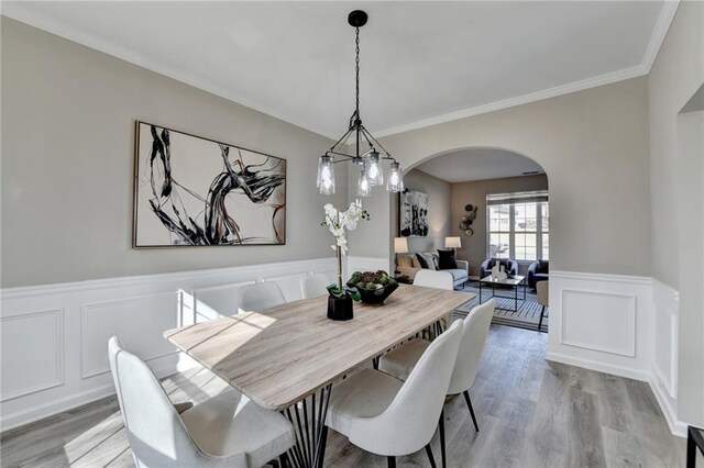 interior details featuring stainless steel electric range, light stone countertops, and white cabinets