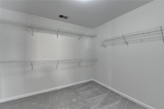 spacious closet featuring carpet floors and visible vents