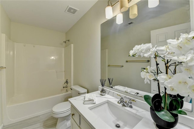 full bathroom with toilet, bathtub / shower combination, visible vents, and vanity