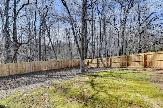 view of yard with a fenced backyard