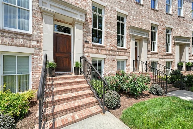 property entrance with brick siding