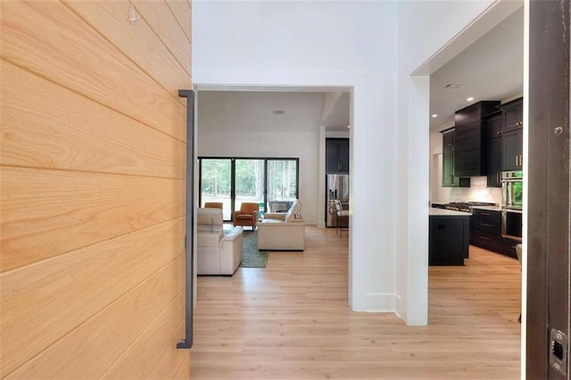 3960 Stock Rd, Monroe, GA 30656 - hall with light wood-type flooring, a towering ceiling, and recessed lighting