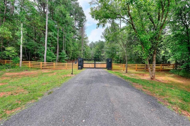 3960 Stock Rd, Monroe, GA 30656 - view of road with a gate and a wooded view