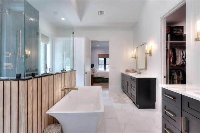 3960 Stock Rd, Monroe, GA 30656 - bathroom with vanity, a freestanding tub, a stall shower, marble look tiles, and ensuite bathroom