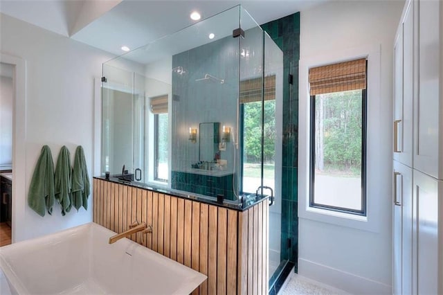 3960 Stock Rd, Monroe, GA 30656 - full bath featuring a shower stall and a soaking tub