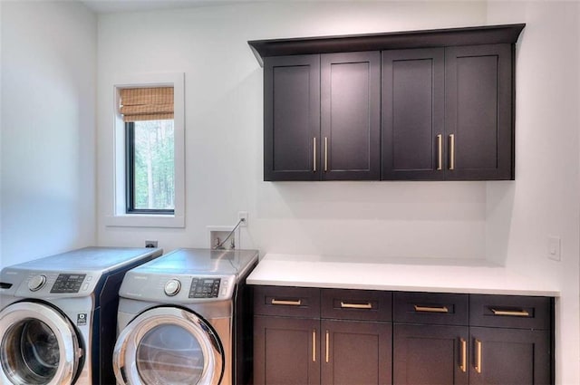 3960 Stock Rd, Monroe, GA 30656 - laundry area featuring cabinet space and independent washer and dryer