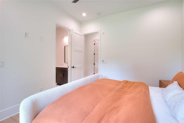 3960 Stock Rd, Monroe, GA 30656 - bedroom with recessed lighting, ensuite bath, and wood finished floors