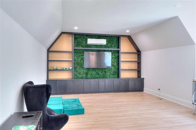 3960 Stock Rd, Monroe, GA 30656 - living area with lofted ceiling, built in shelves, wood finished floors, recessed lighting, and a wall mounted AC