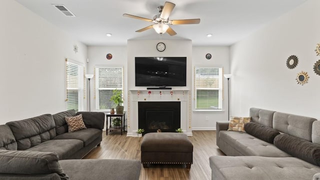 305 Knights Ct, Canton, GA 30115 - living area featuring a fireplace with flush hearth, visible vents, ceiling fan, and a healthy amount of sunlight