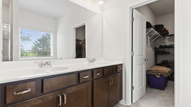 305 Knights Ct, Canton, GA 30115 - bathroom featuring double vanity, a sink, and a spacious closet