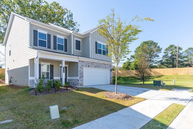 305 Knights Ct, Canton, GA 30115 - view of front of property featuring driveway, board and batten siding, a front yard, fence, and a garage