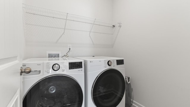 305 Knights Ct, Canton, GA 30115 - laundry area with baseboards, separate washer and dryer, and laundry area