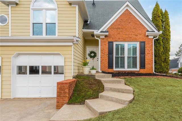 view of front facade featuring brick siding, a shingled roof, concrete driveway, an attached garage, and a front lawn