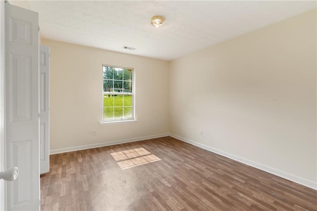 131 Tye St, Stockbridge, GA 30281 - spare room with wood finished floors and baseboards