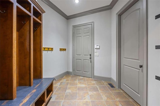 mudroom featuring light tile patterned floors and ornamental molding