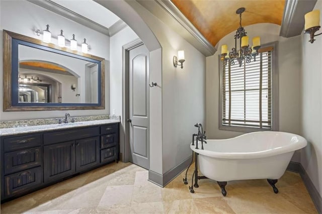 bathroom featuring brick ceiling, a washtub, vanity, an inviting chandelier, and lofted ceiling