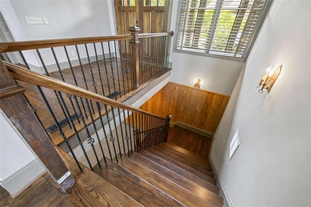 stairs with hardwood / wood-style flooring