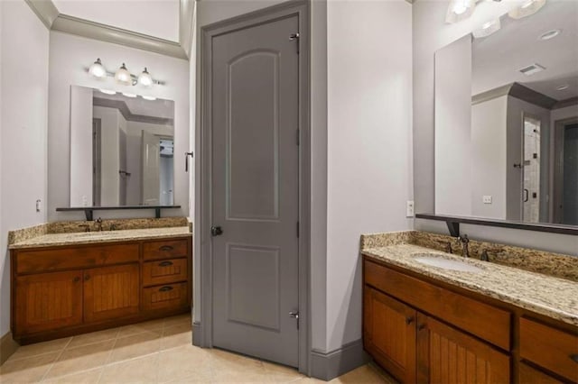 bathroom featuring tile patterned flooring and vanity