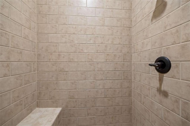 bathroom with a tile shower