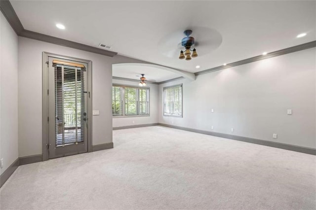 unfurnished room featuring carpet flooring, ceiling fan, and ornamental molding