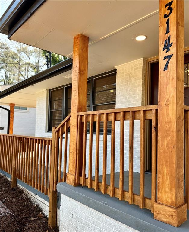 exterior space featuring brick siding