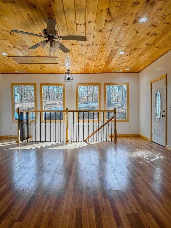 interior space with hardwood / wood-style floors, ceiling fan, wood ceiling, and plenty of natural light