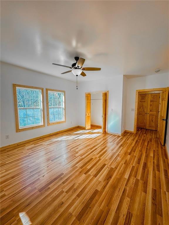 interior space featuring light hardwood / wood-style flooring and ceiling fan