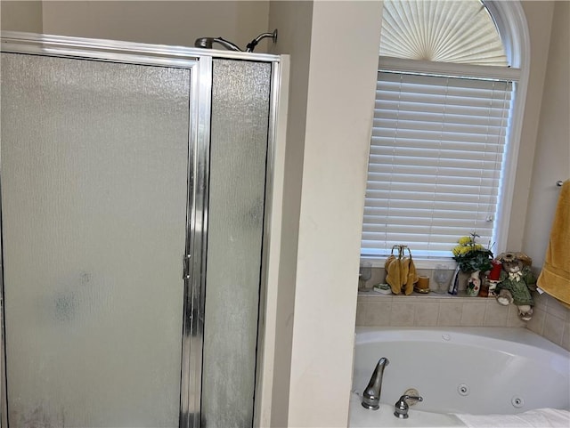 bathroom with separate shower and tub