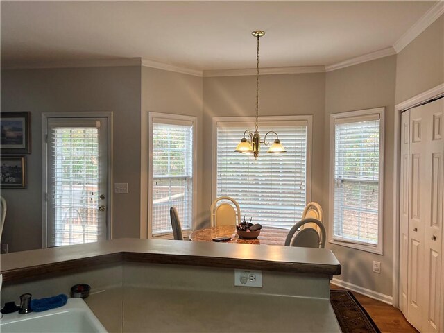 kitchen with black fridge, white dishwasher, crown molding, sink, and light hardwood / wood-style flooring